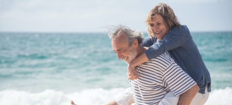 an elderly couple at the beach