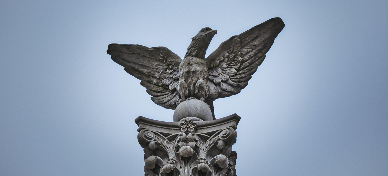 a stone statue of an eagle