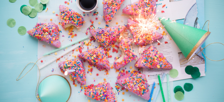 colorful cakes on the table next to other party items