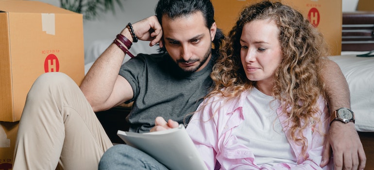 A couple moving and going through paperwork