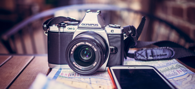 a camera and a smartphone on top of a map