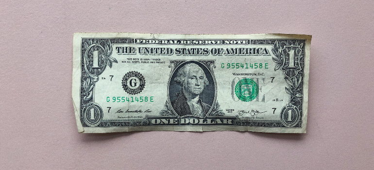 a dollar bill with a picture of George Washington on it