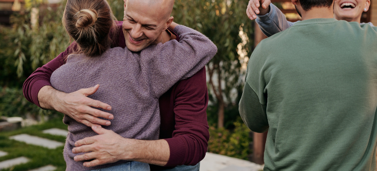 people looking happy and supportive for each other which is something one can experience after moving to Frederick MD as a single parent