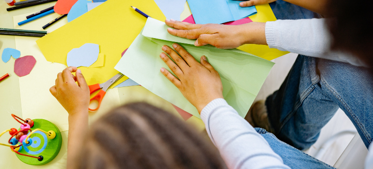 a table covered with various items children can use for arts and crafts activities