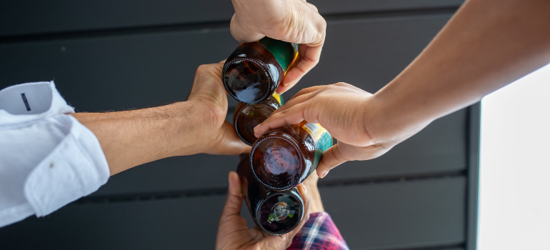 four friends drinking beer