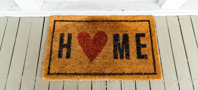 a doormat that has the word "home" printed on it