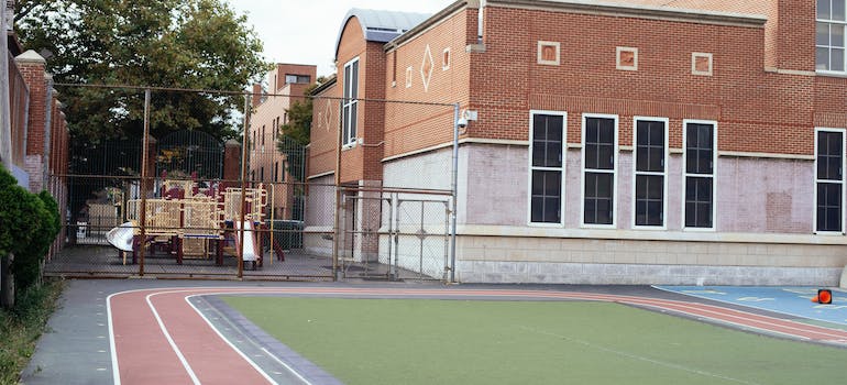 a school building with a tidy yard