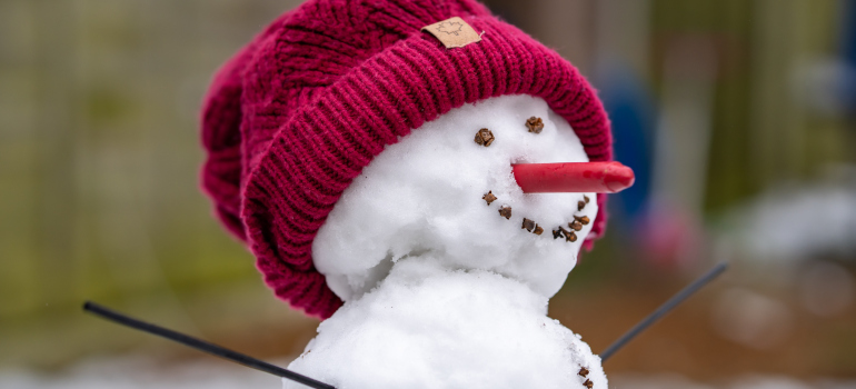a snowman with a red hat