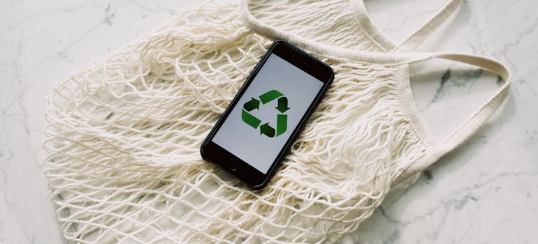 a phone with the symbol of recycling on its screen 