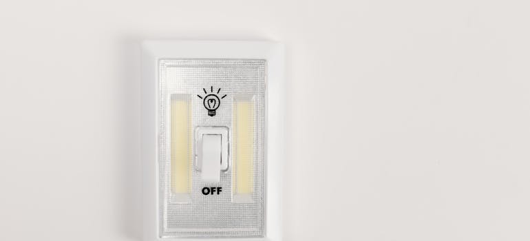 a light switch on a white wall