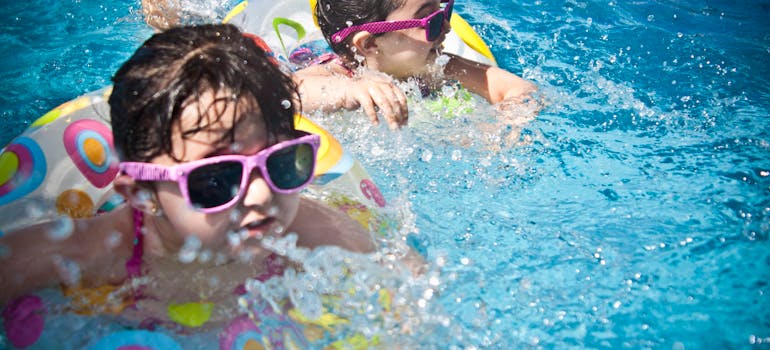 two little girls enjoying a swimming pool