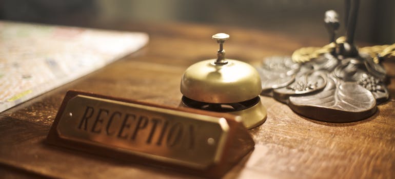 a reception desk with a small desk call bell on it