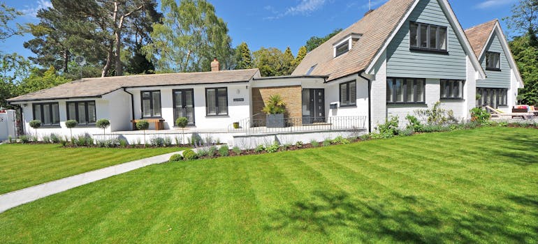 a white house with a beautiful lawn