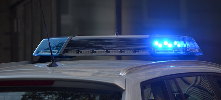 the blue lights on top of a police car