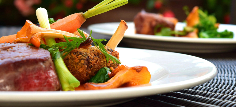 several elegantly decorated dishes in a restaurant