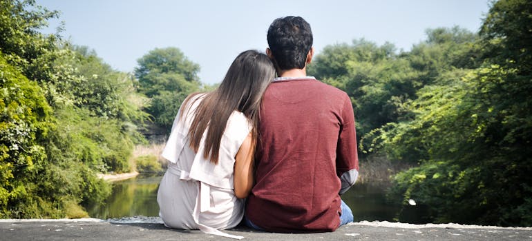 two people leaning on each other while dreaming of a better future, which you should do too when your spouse doesn't want to move