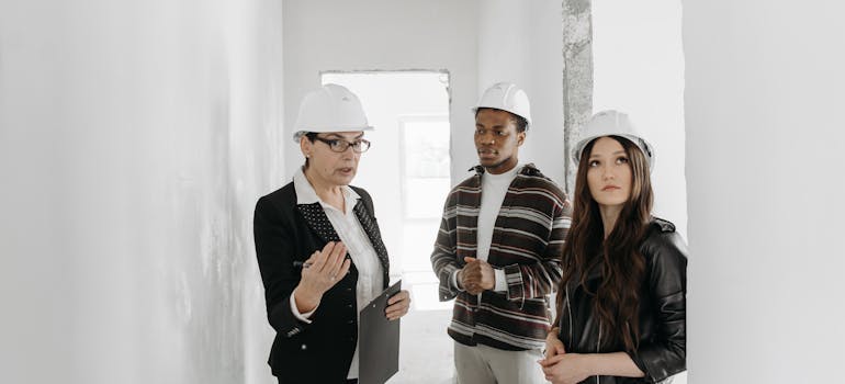 a couple viewing a home together with a real estate agent