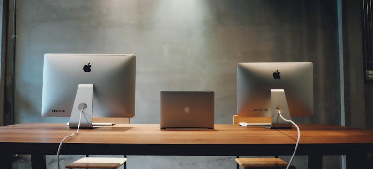 computers on a desk, ready for use, which makes settling into new office space after moving to Ashburn a lot easier