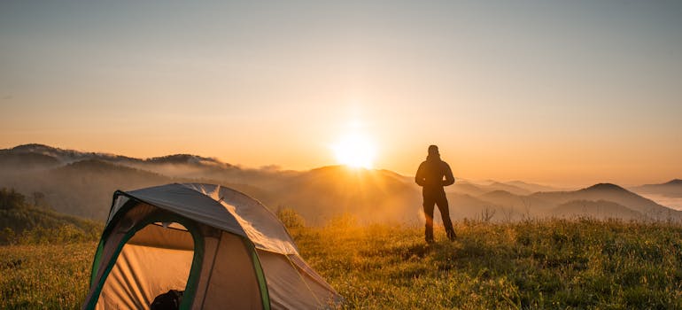 a man camping after moving from a big city to a small town