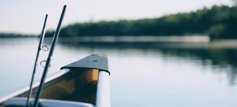 a boat with two fishing rods in it