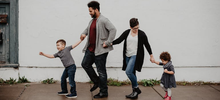 a family holding hands, movers Annapolis MD