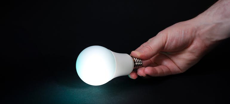 an LED light bulb that a person is holding