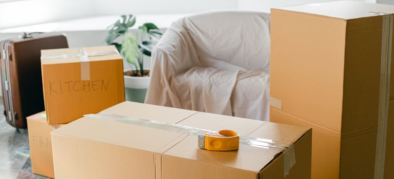 a living room filled with boxes and suitcases