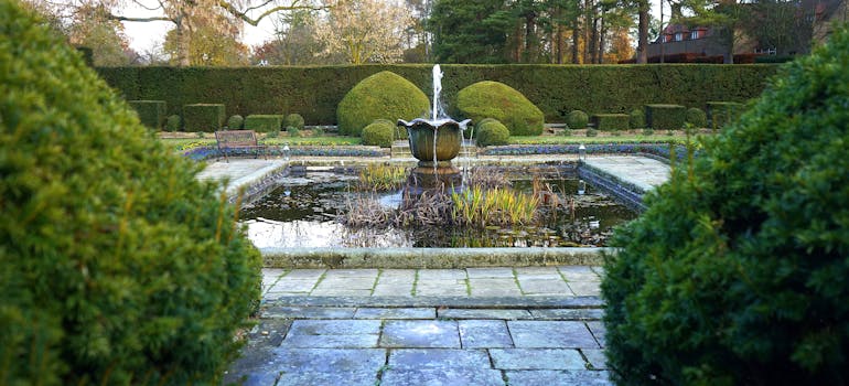 a garden with a fountain 