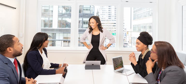 several people in an office discussing what not to do during an office move