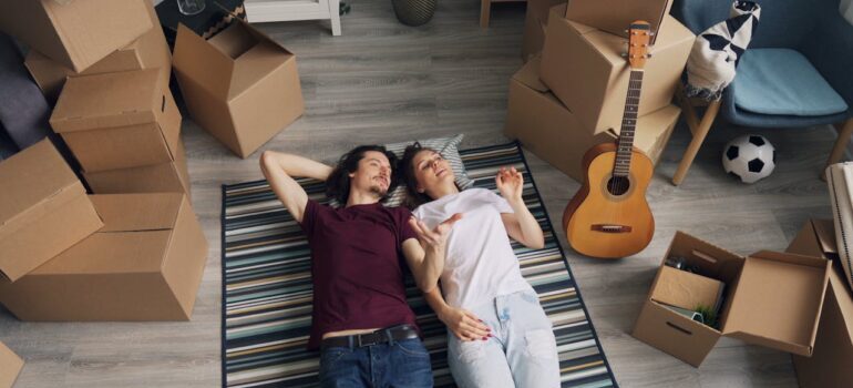 couple lying on carpet