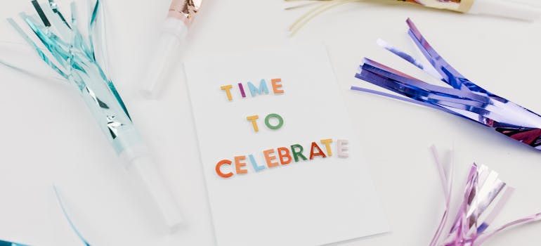 an invitation with colorful letters spelling the phrase "Time to celebrate"