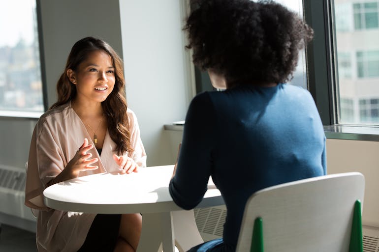 People talking at the table about Maryland cities for singles