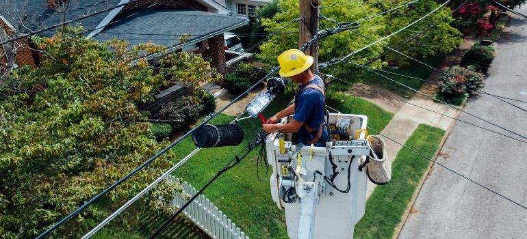 Man Repairing Electrical Wires
