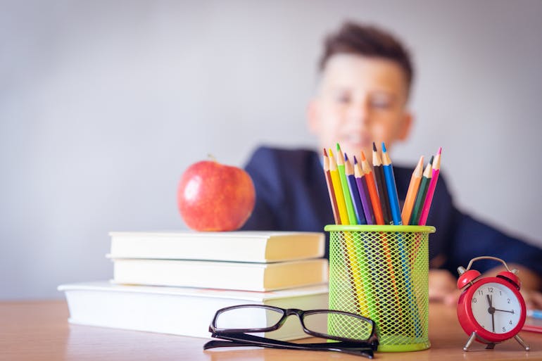 Boy looking on a desk 