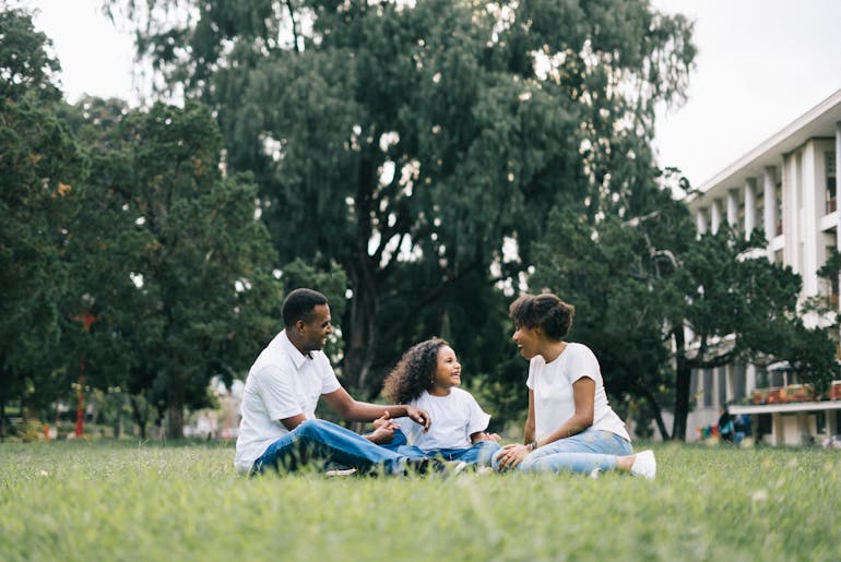 Family sitting and talking about moving to Fredericksburg from Falls Church