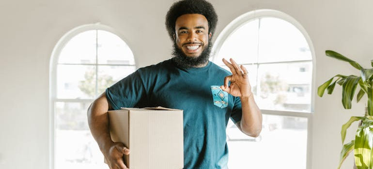 a mover holding a box