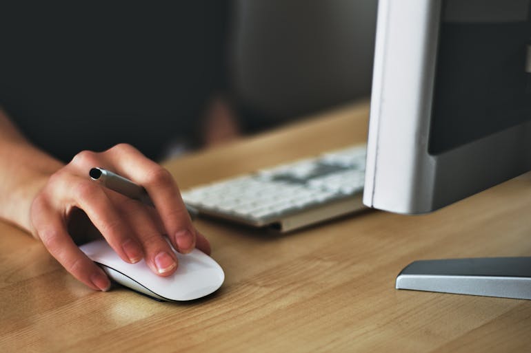 Person using a computer to research moving from DC to Prince George’s County