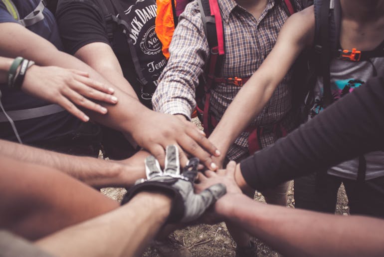 People doing group hand shakes