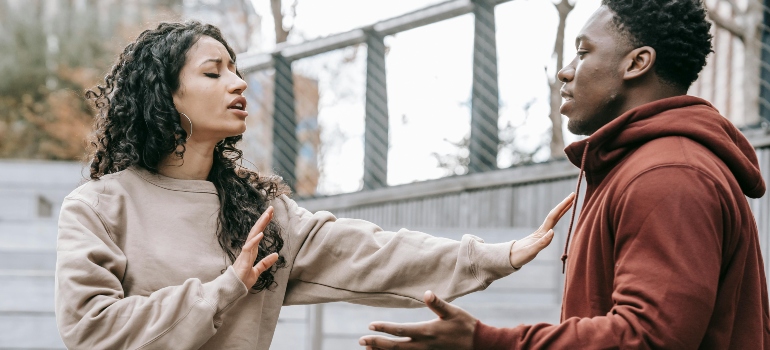 Couple having conflict on street