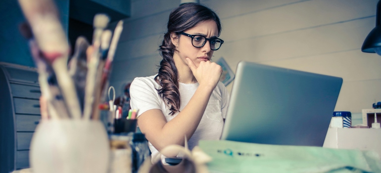 Photo of a Woman Researching Highest Paying Professions in VA on a laptop