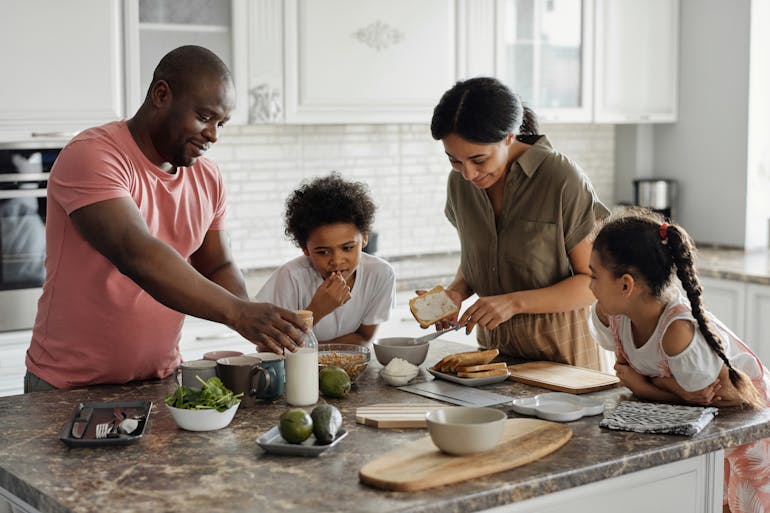 Family making breakfast and talking about moving from Lanham to Severna Park