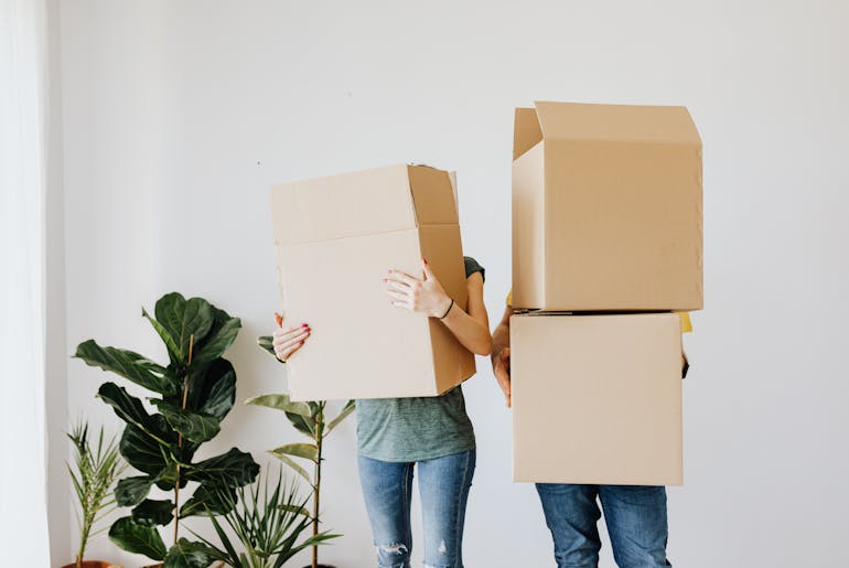 Couple holding boxes 