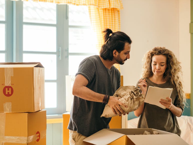 Couple packing boxes 