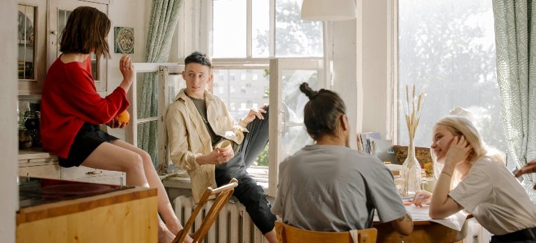 four friends sitting and talking