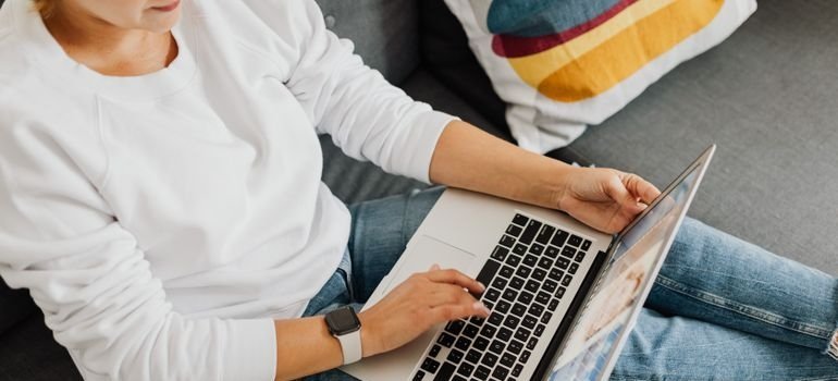 Woman researching living in Prince George’s County on a laptop.