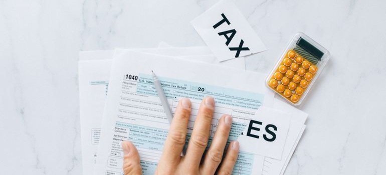 Person looking through tax papers.