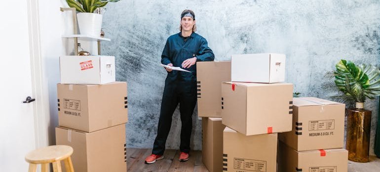a person documenting everything that's being packed