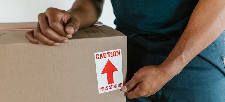 a mover labeling a box