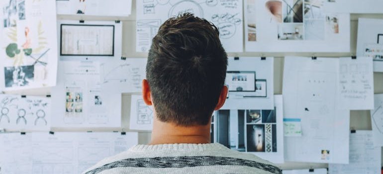person looking at a board and planning