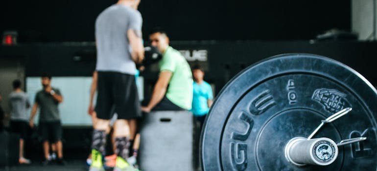 People working out at a gym—an easy place to make new friends in Bethesda after moving from Annapolis.